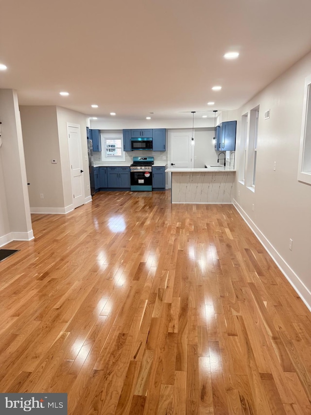 114 Marshall Rd, Lansdowne, PA 19050 - unfurnished living room featuring light wood finished floors, a sink, recessed lighting, and baseboards
