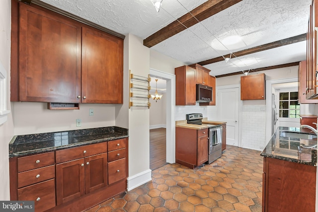 1201 Grenox Rd, Wynnewood, PA 19096 - kitchen with stainless steel electric stove, black microwave, a sink, dark stone counters, and decorative backsplash