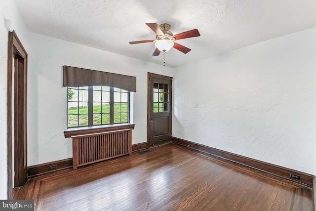 1201 Grenox Rd, Wynnewood, PA 19096 - empty room featuring radiator, wood finished floors, baseboards, and a ceiling fan