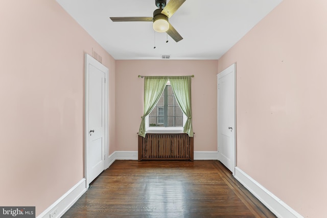 1201 Grenox Rd, Wynnewood, PA 19096 - unfurnished room featuring radiator heating unit, a ceiling fan, wood finished floors, and baseboards