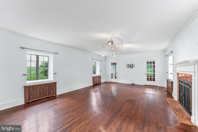 1201 Grenox Rd, Wynnewood, PA 19096 - unfurnished living room featuring radiator, wood finished floors, a fireplace, ornamental molding, and baseboards
