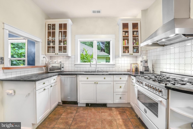 15 Jefferson Ave, Takoma Park, MD 20912 - kitchen featuring wall chimney range hood, high end white range oven, a sink, dishwasher, and healthy amount of natural light