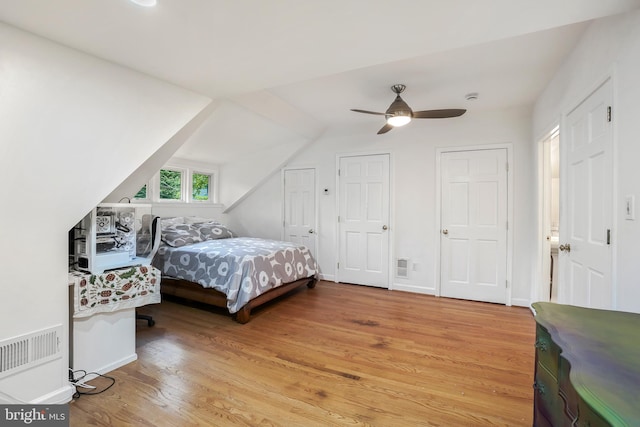 15 Jefferson Ave, Takoma Park, MD 20912 - bedroom featuring wood finished floors, lofted ceiling, ceiling fan, baseboards, and multiple closets