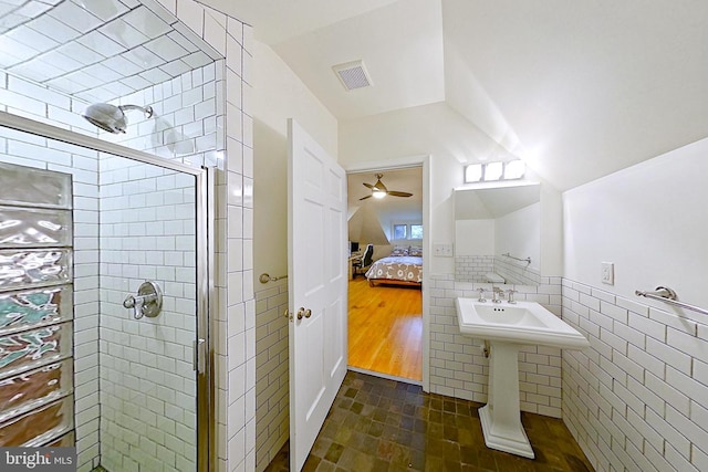 15 Jefferson Ave, Takoma Park, MD 20912 - full bathroom featuring a shower stall, ensuite bathroom, tile walls, and lofted ceiling