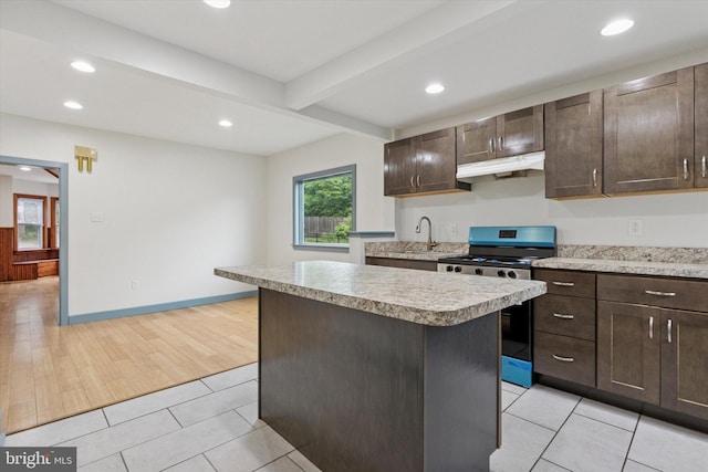 603 Vernon St, Media, PA 19063 - kitchen with stainless steel range with gas cooktop, under cabinet range hood, light countertops, dark brown cabinetry, and recessed lighting