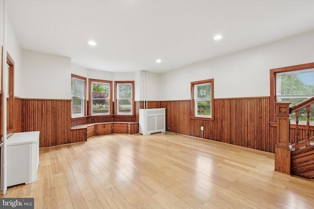 603 Vernon St, Media, PA 19063 - unfurnished room with a wainscoted wall, stairway, light wood-type flooring, wood walls, and recessed lighting