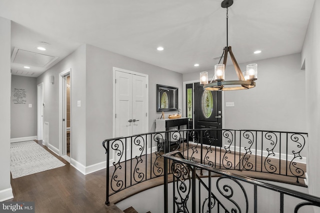 2302 Solmar Dr, Silver Spring, MD 20904 - stairway featuring wood finished floors, a chandelier, baseboards, recessed lighting, and attic access