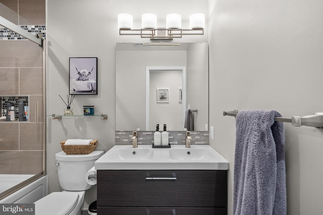 2302 Solmar Dr, Silver Spring, MD 20904 - full bathroom with toilet, vanity, tasteful backsplash, and bath / shower combo with glass door