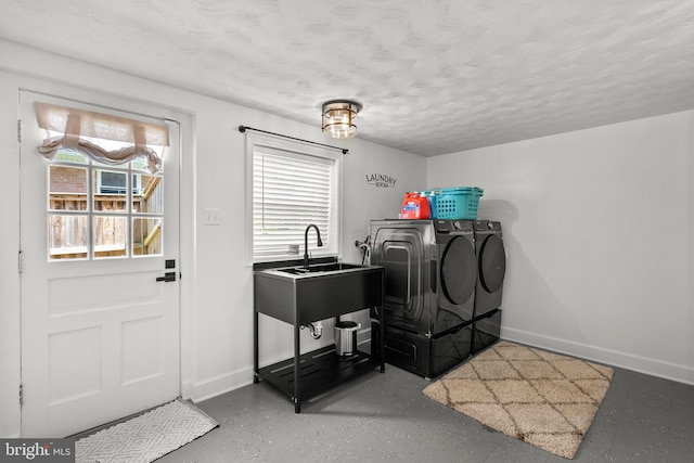 2302 Solmar Dr, Silver Spring, MD 20904 - laundry room with independent washer and dryer, baseboards, and a textured ceiling