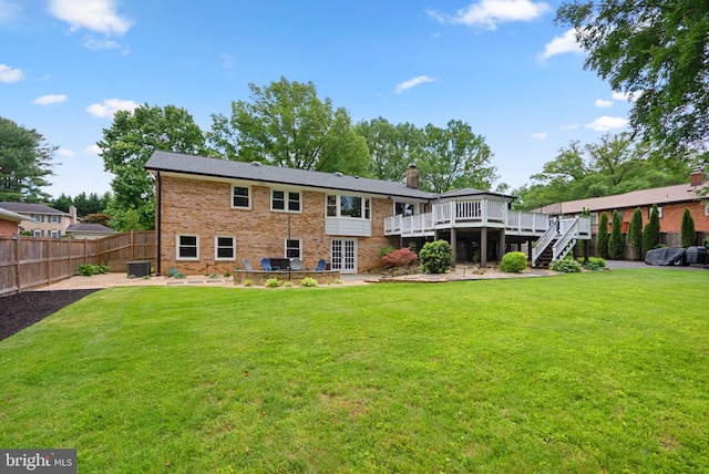 2302 Solmar Dr, Silver Spring, MD 20904 - rear view of house featuring a wooden deck, central AC, stairway, a chimney, and brick siding