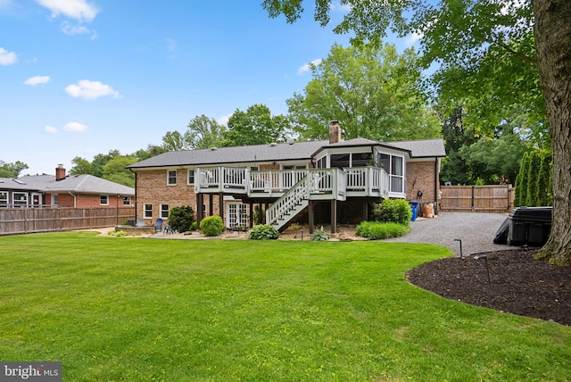 2302 Solmar Dr, Silver Spring, MD 20904 - rear view of house featuring a deck, a sunroom, stairway, a patio area, and brick siding