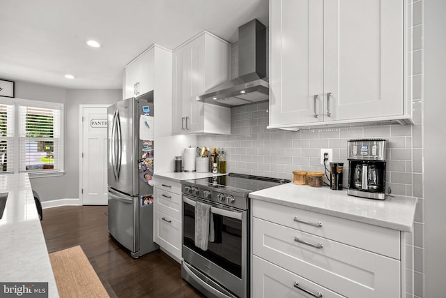 2302 Solmar Dr, Silver Spring, MD 20904 - kitchen featuring appliances with stainless steel finishes, wall chimney range hood, white cabinetry, decorative backsplash, and recessed lighting