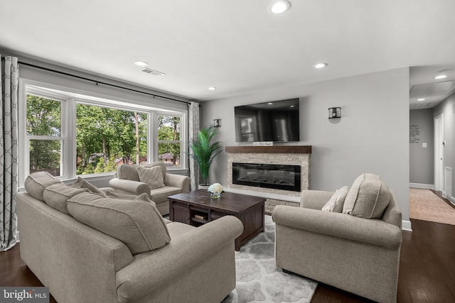 2302 Solmar Dr, Silver Spring, MD 20904 - living room with healthy amount of natural light, wood finished floors, a fireplace, baseboards, and recessed lighting