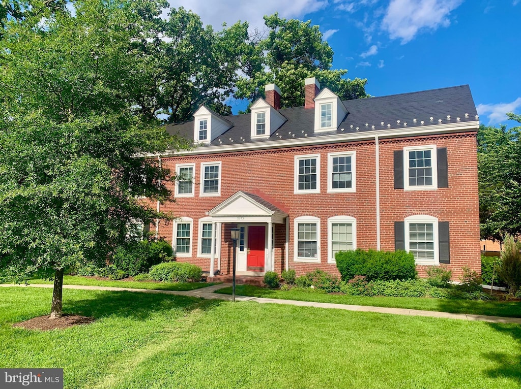 3373 S Stafford St Unit B2, Arlington, VA 22206 - colonial-style house featuring brick siding, a front lawn, and a chimney