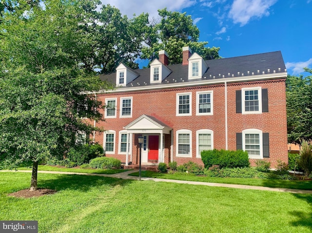 3373 S Stafford St Unit B2, Arlington, VA 22206 - colonial-style house featuring brick siding, a front lawn, and a chimney