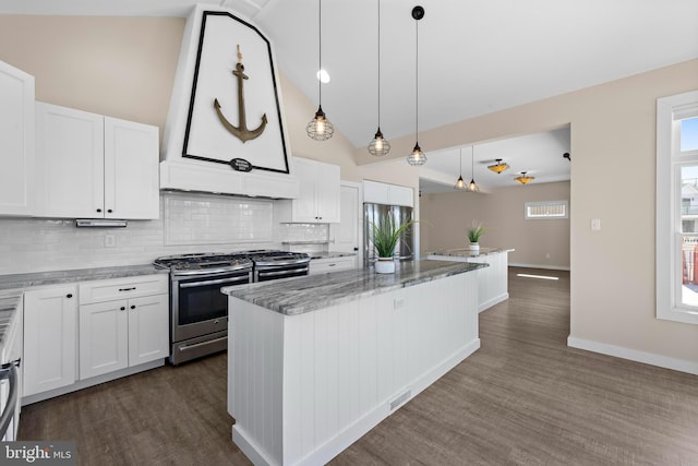 1169 Jennifer Ln, Manahawkin, NJ 08050 - kitchen with stainless steel appliances, decorative backsplash, a center island, dark wood-type flooring, and white cabinetry