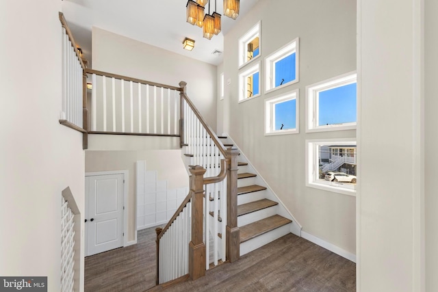 1169 Jennifer Ln, Manahawkin, NJ 08050 - stairway featuring wood finished floors, baseboards, and a towering ceiling