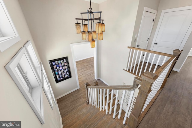 1169 Jennifer Ln, Manahawkin, NJ 08050 - staircase with baseboards, wood finished floors, and a chandelier