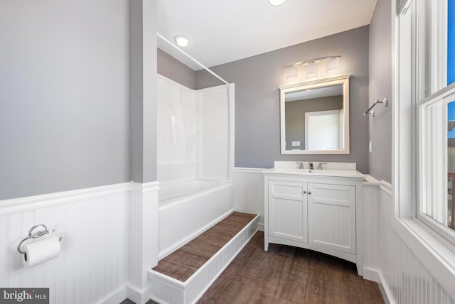 1169 Jennifer Ln, Manahawkin, NJ 08050 - full bathroom featuring wainscoting, vanity, tub / shower combination, wood finished floors, and a decorative wall