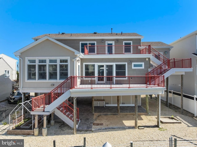 1169 Jennifer Ln, Manahawkin, NJ 08050 - rear view of property with stairs and a balcony