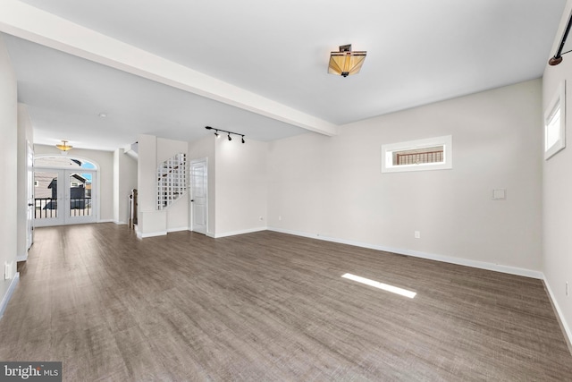 1169 Jennifer Ln, Manahawkin, NJ 08050 - unfurnished living room with plenty of natural light, baseboards, wood finished floors, and stairs