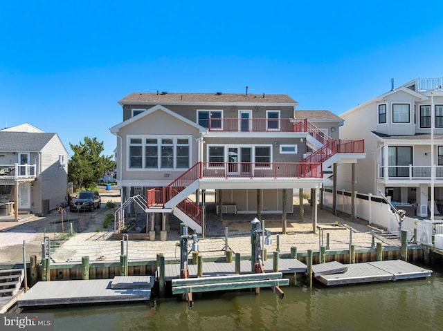 1169 Jennifer Ln, Manahawkin, NJ 08050 - rear view of property featuring stairs, a deck with water view, and a patio area