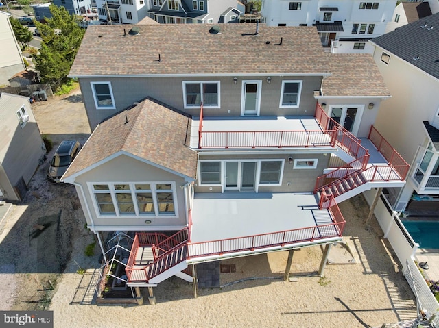 1169 Jennifer Ln, Manahawkin, NJ 08050 - back of property featuring stairs, a balcony, and roof with shingles