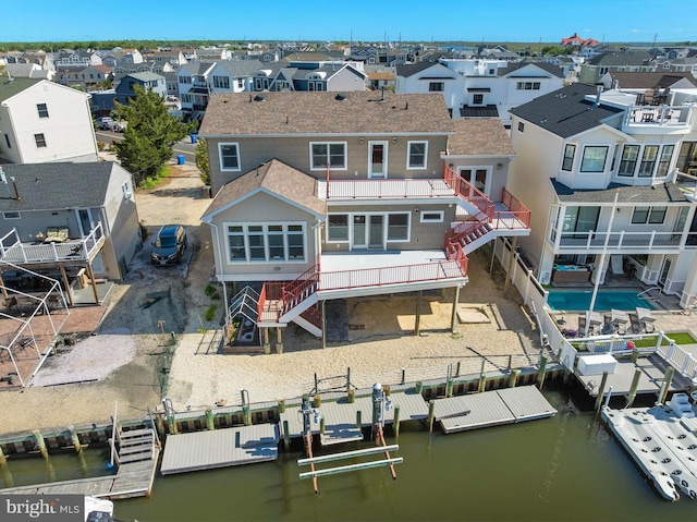 1169 Jennifer Ln, Manahawkin, NJ 08050 - back of property with a residential view, stairway, a water view, and a fenced backyard