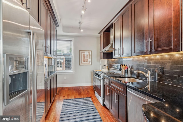 2031 Pine St Unit 4, Philadelphia, PA 19103 - kitchen featuring stainless steel appliances, baseboards, a sink, tasteful backsplash, and light wood-style floors
