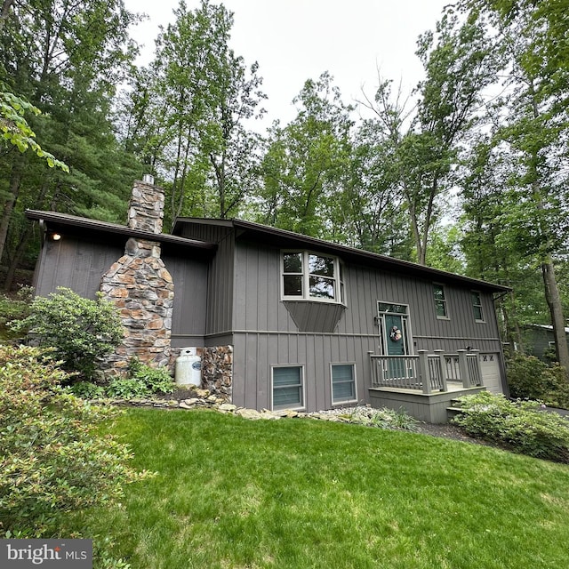 8201 Michaux Dr, Fayetteville, PA 17222 - view of front of home with a front yard and a chimney