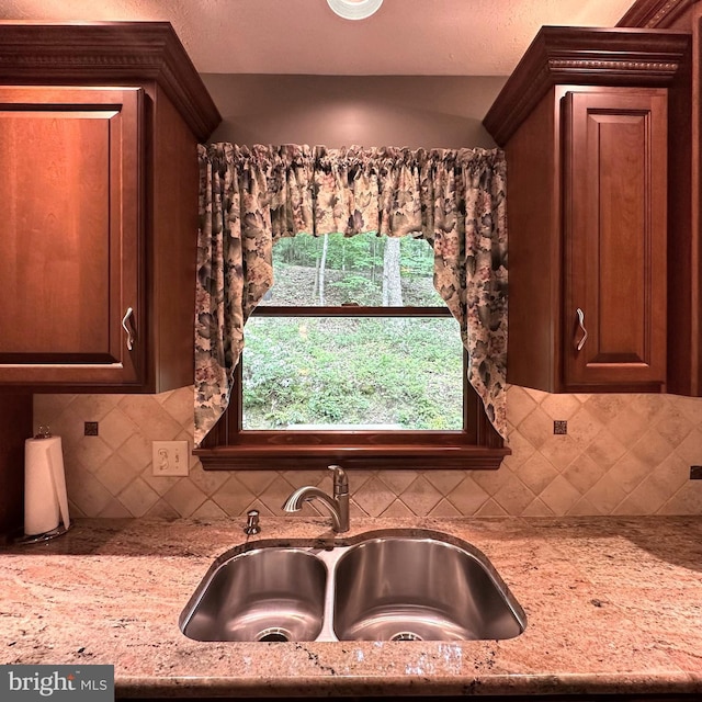8201 Michaux Dr, Fayetteville, PA 17222 - kitchen featuring a sink, light stone counters, and tasteful backsplash