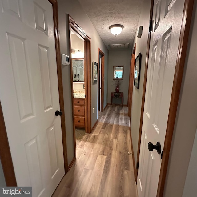 8201 Michaux Dr, Fayetteville, PA 17222 - hall with light wood-style flooring and a textured ceiling
