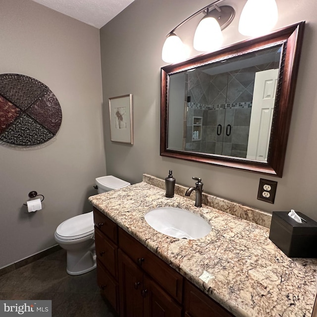 8201 Michaux Dr, Fayetteville, PA 17222 - bathroom with vanity, a stall shower, toilet, baseboards, and tile patterned floors