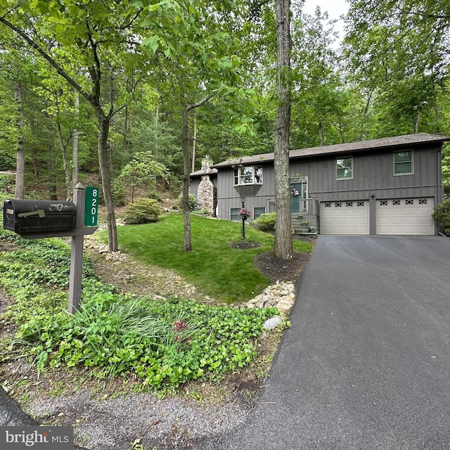 8201 Michaux Dr, Fayetteville, PA 17222 - view of front of property featuring asphalt driveway, a front lawn, and a garage