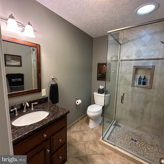 8201 Michaux Dr, Fayetteville, PA 17222 - full bathroom featuring vanity, toilet, a shower stall, a textured ceiling, and baseboards