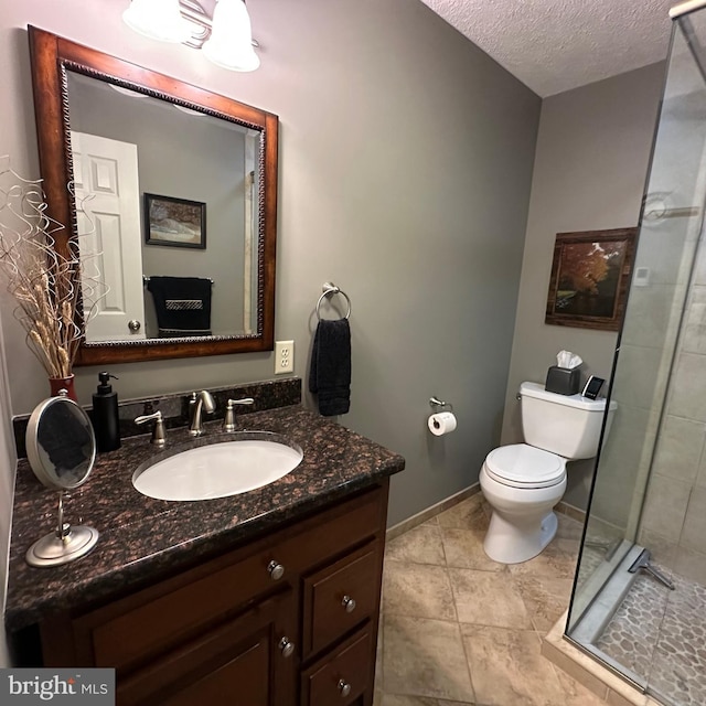 8201 Michaux Dr, Fayetteville, PA 17222 - full bathroom with toilet, vanity, a shower stall, a textured ceiling, and baseboards