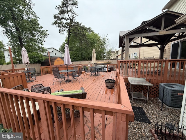 154 Bayshore Dr, Barnegat, NJ 08005 - wooden terrace featuring outdoor dining space and central air condition unit