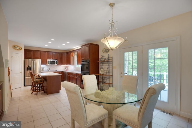 40801 Kiskadee Ln, Leonardtown, MD 20650 - dining area featuring light tile patterned flooring, baseboards, and recessed lighting