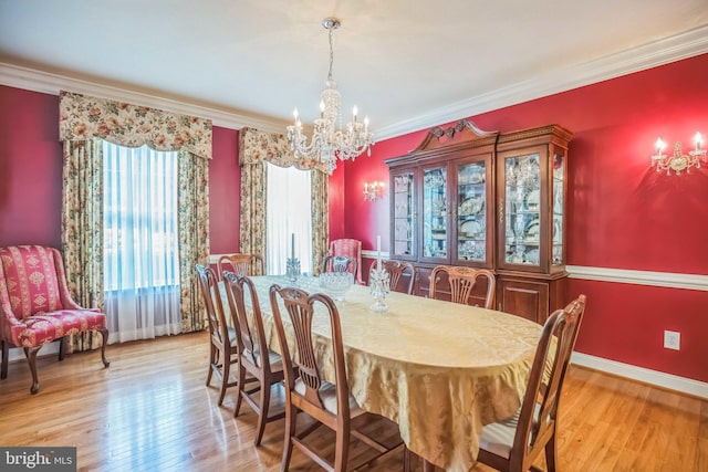 40801 Kiskadee Ln, Leonardtown, MD 20650 - dining area with a chandelier, light wood-style flooring, ornamental molding, and baseboards
