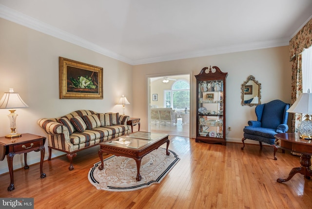40801 Kiskadee Ln, Leonardtown, MD 20650 - living area featuring light wood-style floors, crown molding, and baseboards