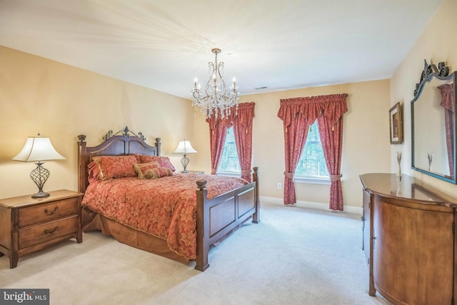 40801 Kiskadee Ln, Leonardtown, MD 20650 - bedroom with a chandelier, light carpet, and baseboards