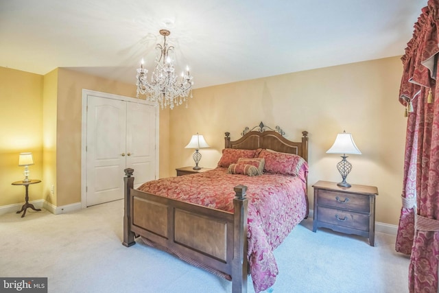 40801 Kiskadee Ln, Leonardtown, MD 20650 - bedroom with light carpet, a chandelier, a closet, and baseboards