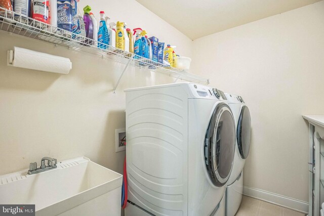 40801 Kiskadee Ln, Leonardtown, MD 20650 - laundry area featuring washer and clothes dryer and baseboards