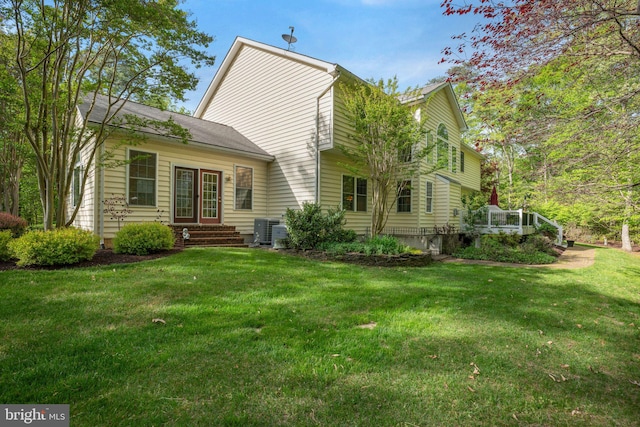 40801 Kiskadee Ln, Leonardtown, MD 20650 - rear view of house with a lawn, cooling unit, and entry steps