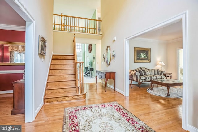40801 Kiskadee Ln, Leonardtown, MD 20650 - foyer with crown molding, wood finished floors, stairway, and baseboards