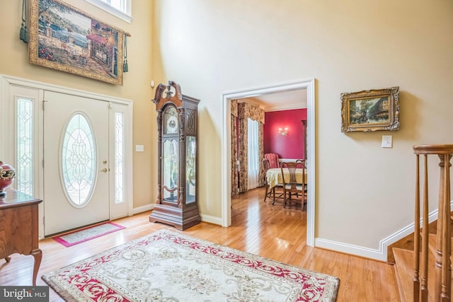 40801 Kiskadee Ln, Leonardtown, MD 20650 - entryway with light wood-type flooring, a high ceiling, and baseboards