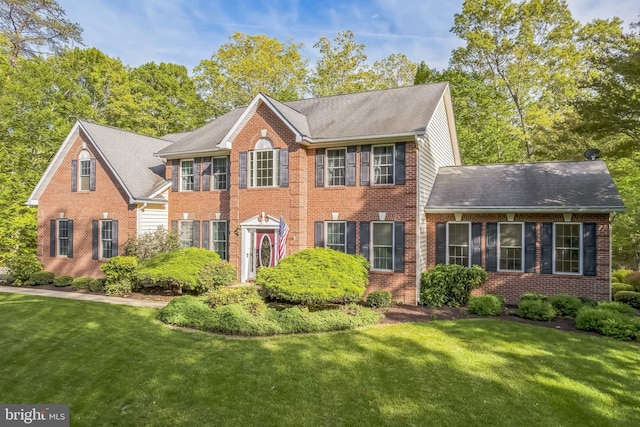 40801 Kiskadee Ln, Leonardtown, MD 20650 - view of front of property with brick siding, a front lawn, and a shingled roof