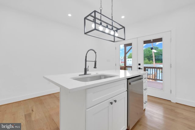5318 5th St NW, Washington, DC 20011 - kitchen with stainless steel dishwasher, a sink, french doors, light wood-type flooring, and recessed lighting