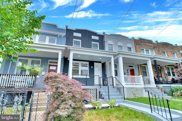 5318 5th St NW, Washington, DC 20011 - multi unit property featuring a porch, brick siding, mansard roof, and stairs