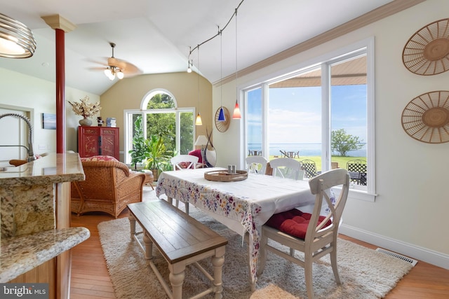 5520 Leeward Ln, Tilghman, MD 21671 - dining room with light wood-style floors, lofted ceiling, ceiling fan, and baseboards